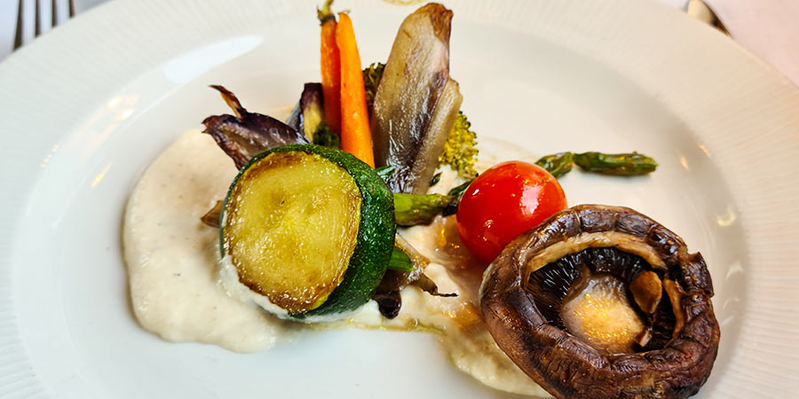 A meal onboard the Al Andalus: it is comprised of chargrilled vegetables on a bed of hummus.